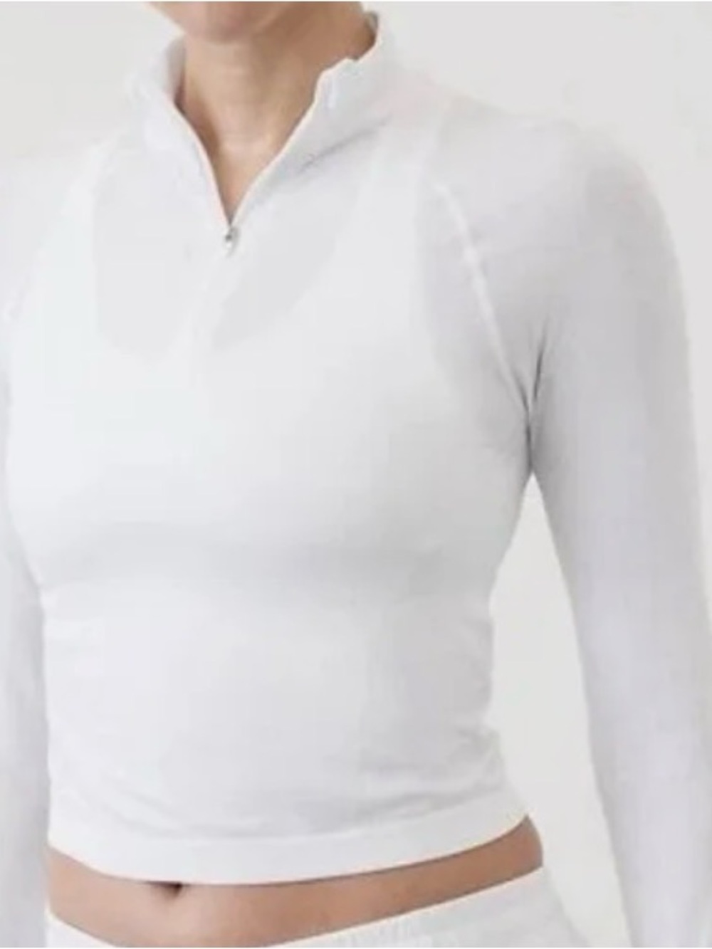 Athleta woman’s White cropped long sleeve athletic top with zipper